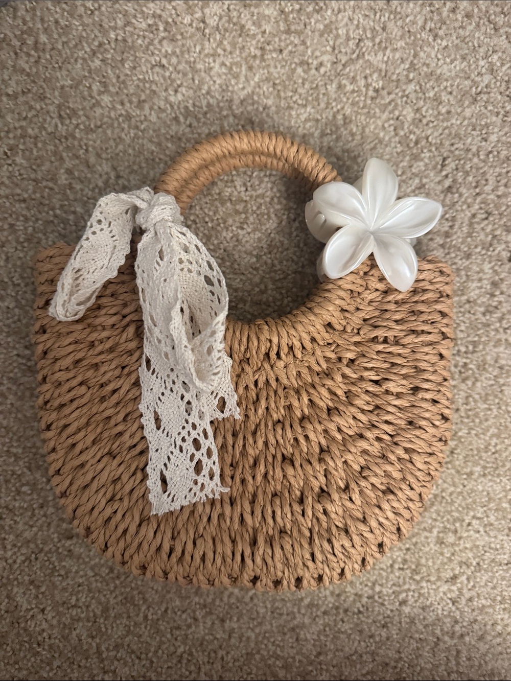 Woven Straw Half-Moon Crossbody with White Flower Accent